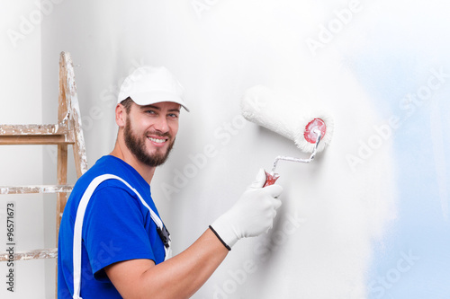 painter in white dungarees, blue t-shirt