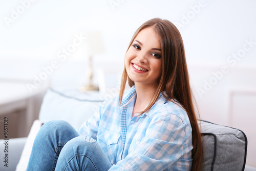Pretty young woman at home