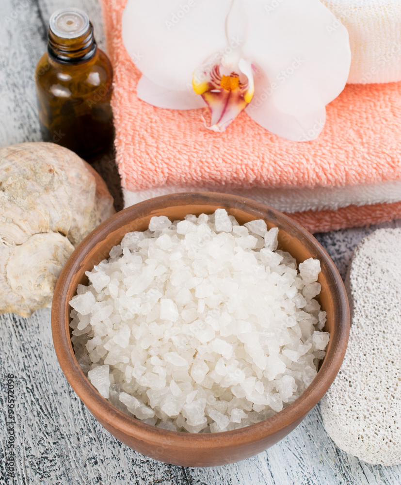 Spa salon with sea salt, towels and flowers Spa salon with sea salt, towels and flowers