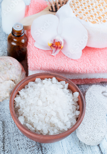 Spa salon with sea salt, towels and flowers