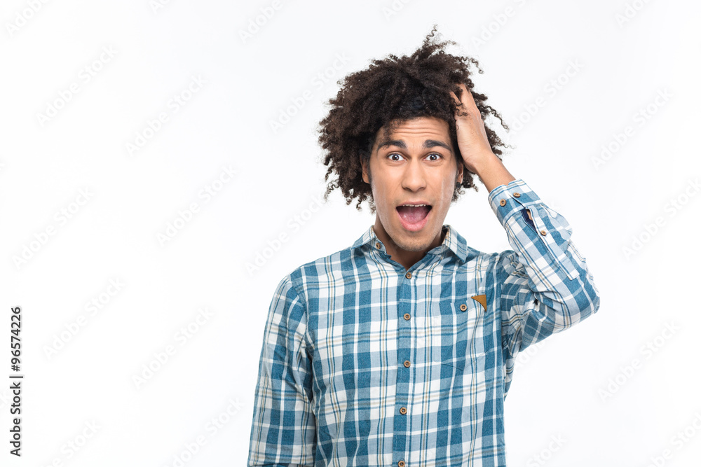 Amazed afro american man with curly hair looking at camera Amazed afro american man with curly hair looking at camera