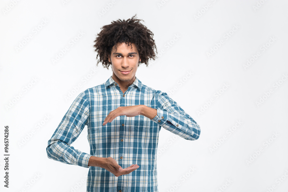 Afro american man holding something invisible Afro american man holding something invisible
