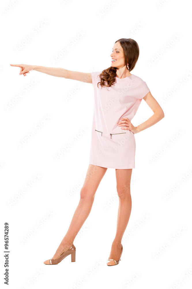 Young slim pretty woman in pink dress posing