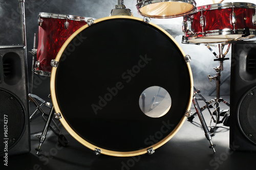 Drum set in smoke on a stage
