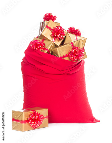 Red Christmas sack with wrapped gift boxes isolated on white