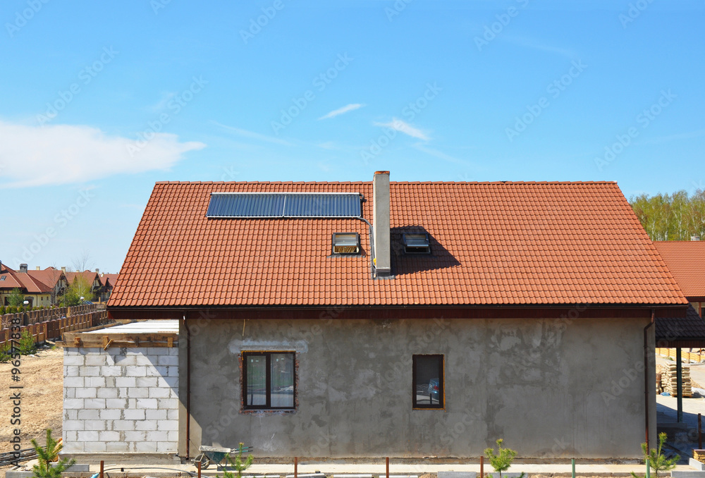 Beautiful New Building House Energy Efficiency Solution Concept Outdoor. Solar Energy, Solar Water Heater, Rain Gutter, Skylights, Installed on Ceramic Red Tiled Roof Exterior. Plastering Facade Wall Beautiful New Building House Energy Efficiency Solution Concept Outdoor. Solar Energy, Solar Water Heater, Rain Gutter, Skylights, Installed on Ceramic Red Tiled Roof Exterior. Plastering Facade Wall