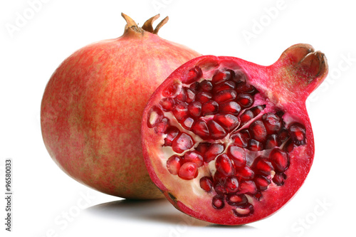 very juicy and big and delicious pomegranate in the section on white isolated background
