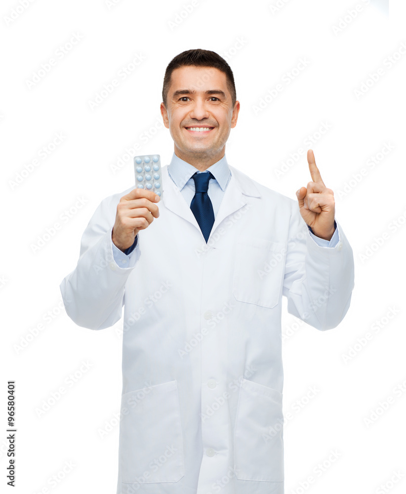 smiling male doctor in white coat with tablets smiling male doctor in white coat with tablets