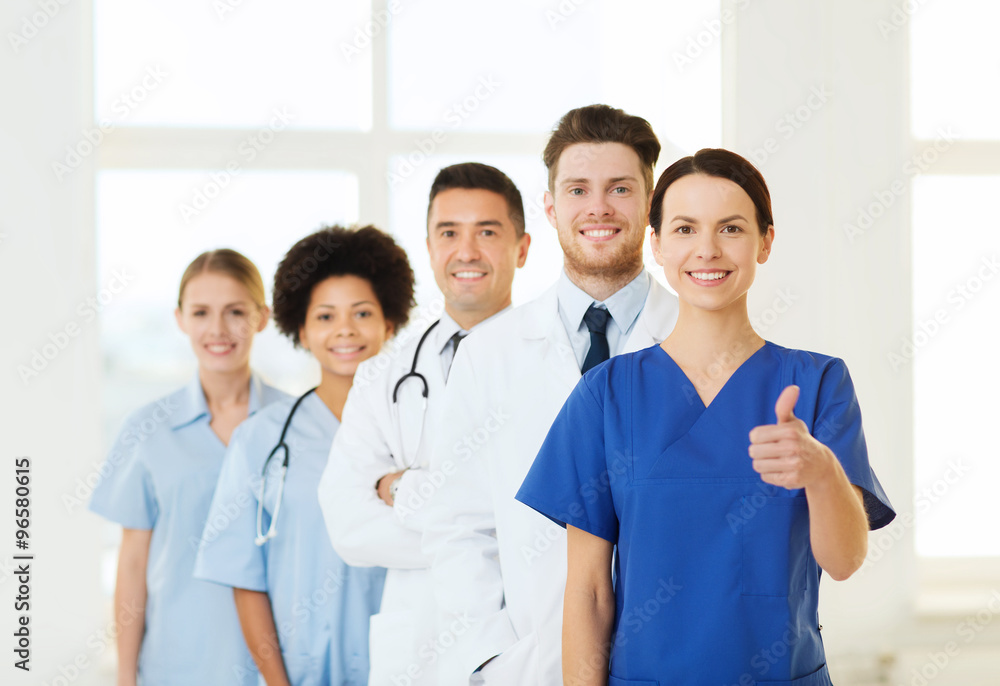 happy doctors showing thumbs up at hospital happy doctors showing thumbs up at hospital