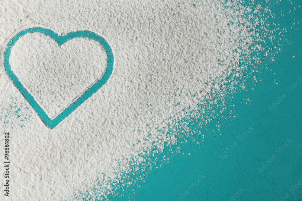 Heart of flour on color wooden background Heart of flour on color wooden background