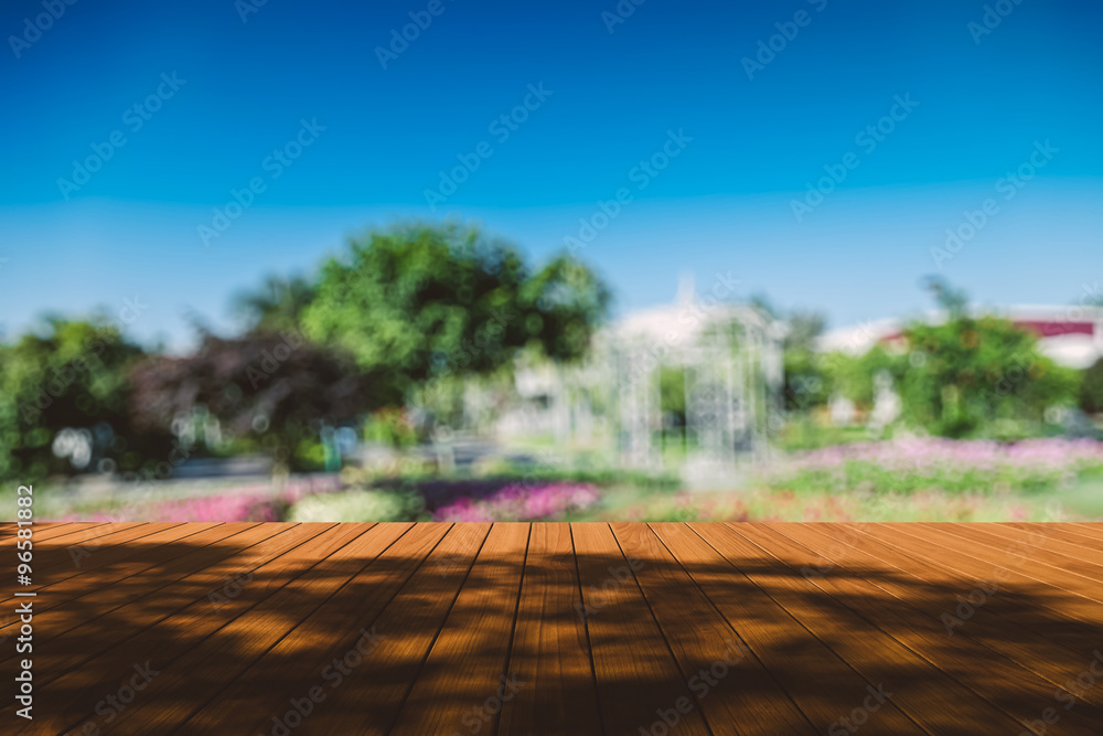 Obraz premium Beautiful sunlight in the autumn forest with wood planks floor