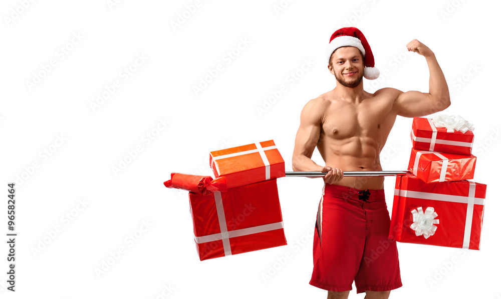 Let us train together. Studio shot of a toned shirtless Santa Claus after a workout with barbell full of gift boxes copyspace on the side Let us train together. Studio shot of a toned shirtless Santa Claus after a workout with barbell full of gift boxes copyspace on the side