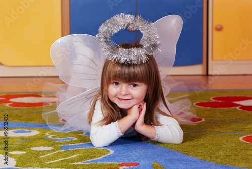 Tree-year girl playing and learning in preschool