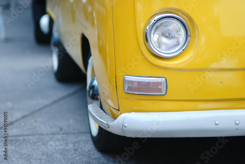 Yellow bus with one headlight