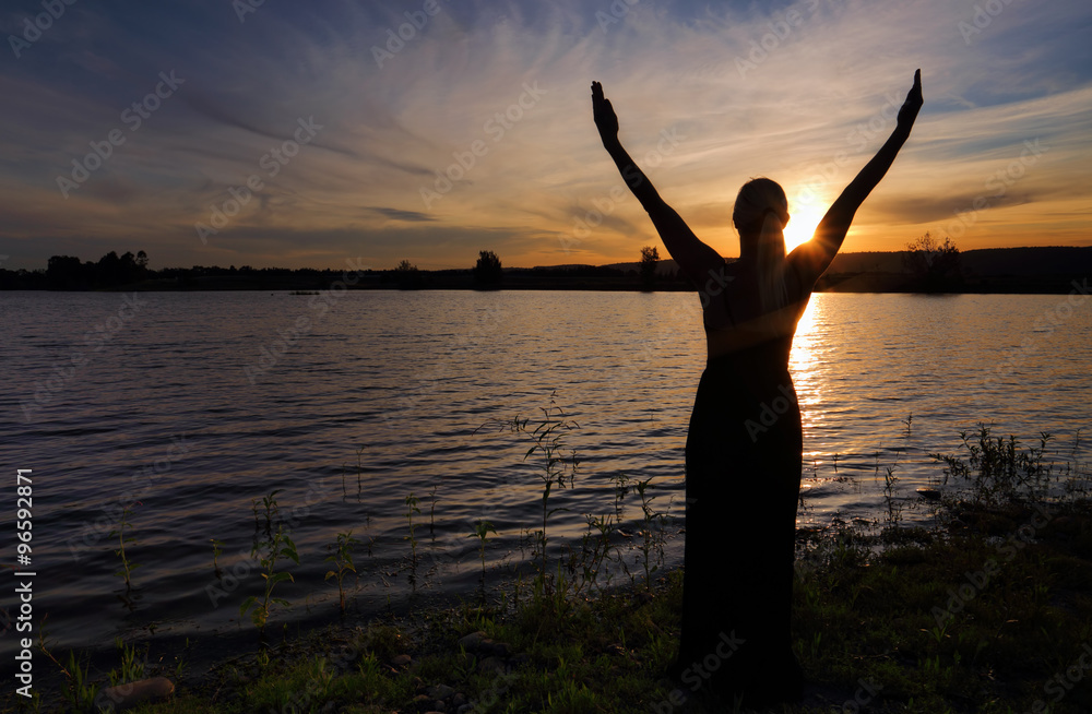 Rejoice Life - woman  against sunset sky
