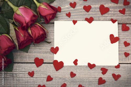 Piece of paper in the middle of felt hearts