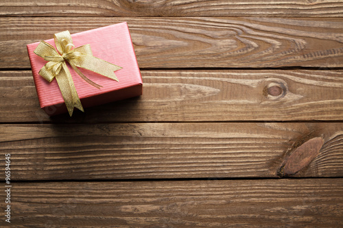Christmas presents on wooden table background.