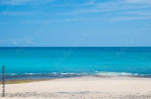 The blue sea and blue sky on the beach Dreamland in Bali, Indonesia. © avtk