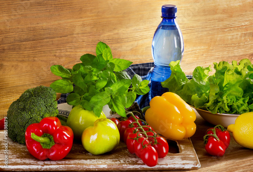 Fresh organic vegetables with bottle of water