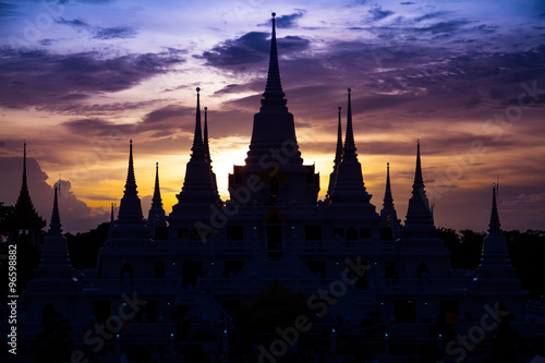 The silhouette of a temple at dusk.