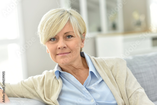 Portrait of senior woman relaxing in sofa