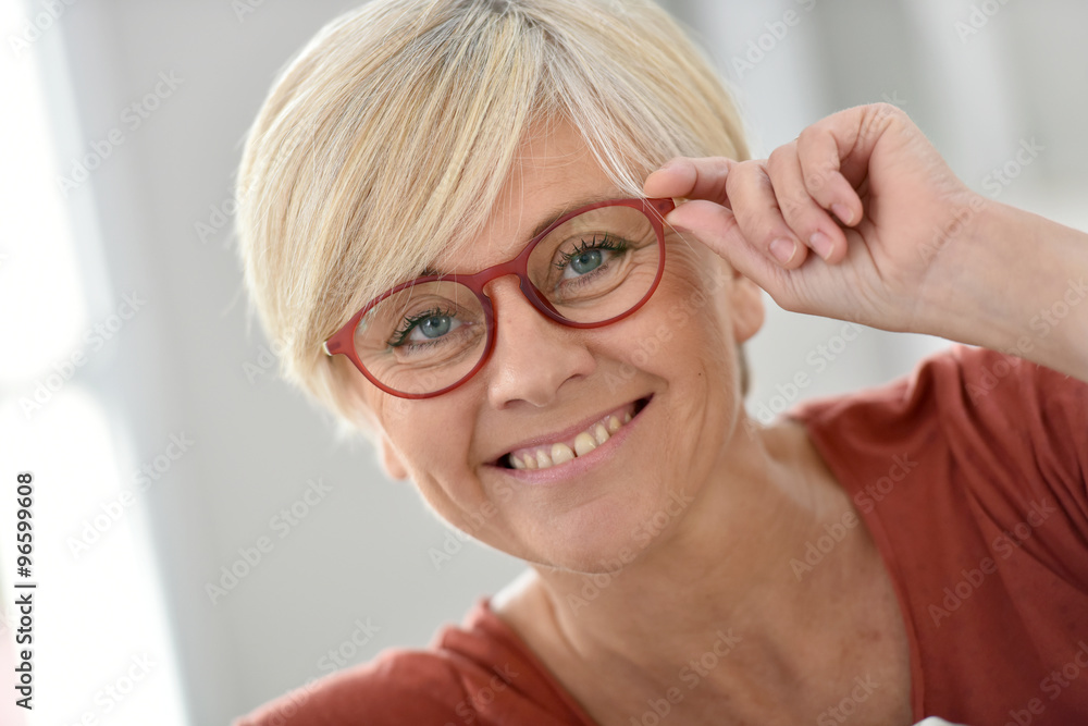 Portrait of smiling senior woman with eyeglasses Portrait of smiling senior woman with eyeglasses
