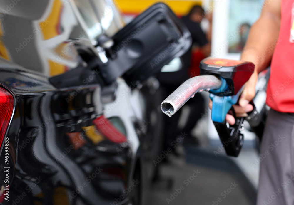 Man holding petrol pump Man holding petrol pump