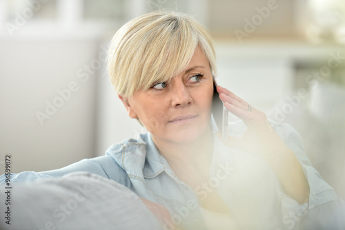 Closeup of senior woman talking on phone