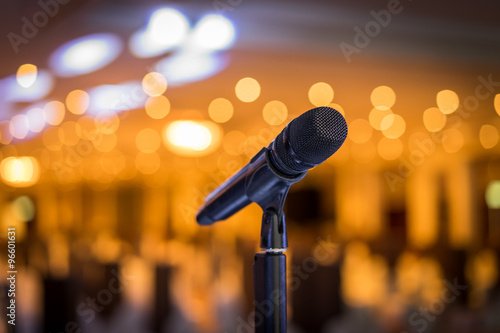 Wireless microphone stand on the stage venue with blur bokeh bac