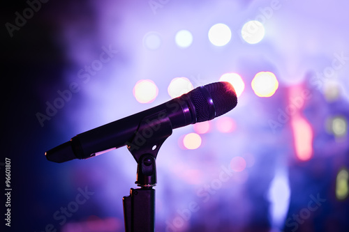 Wireless microphone stand on the stage venue with blur bokeh bac