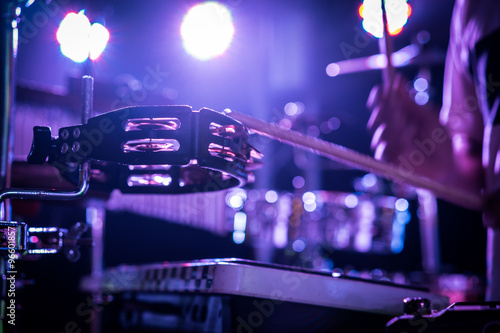 Percussionist hitting the tambourine on the concert stage