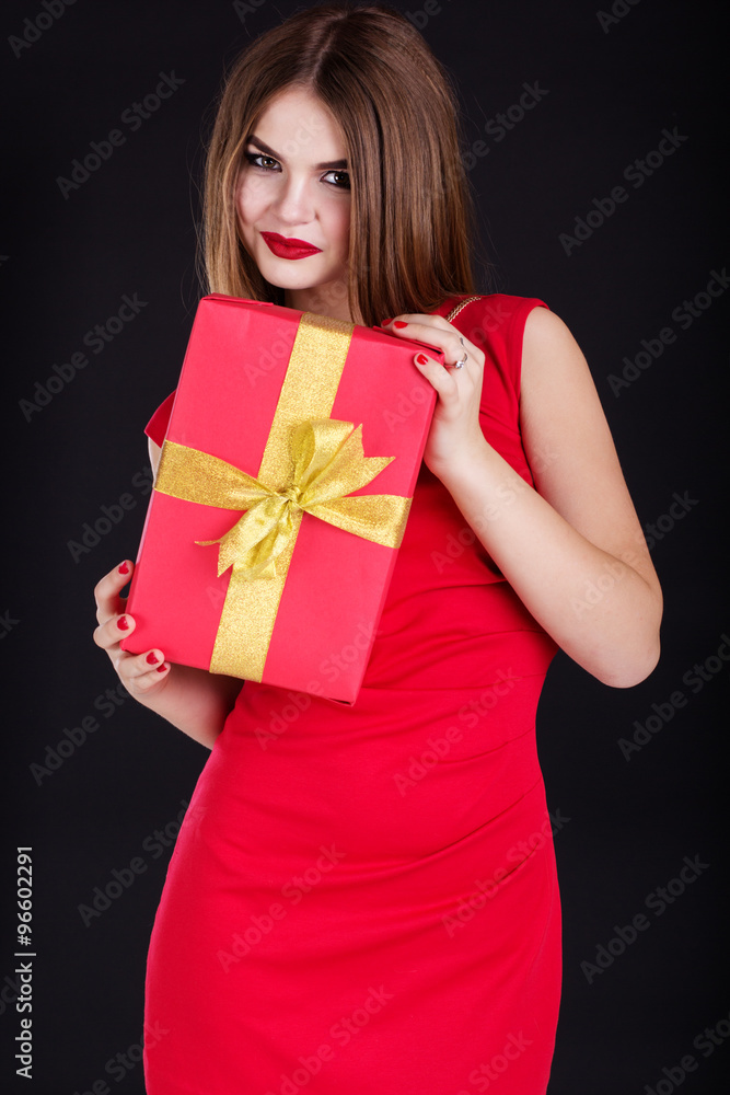 Pretty girl is wearing fashion dress with gift box Pretty girl is wearing fashion dress with gift box