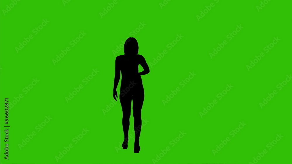 Female silhouette dancing on green background Female silhouette dancing on green background