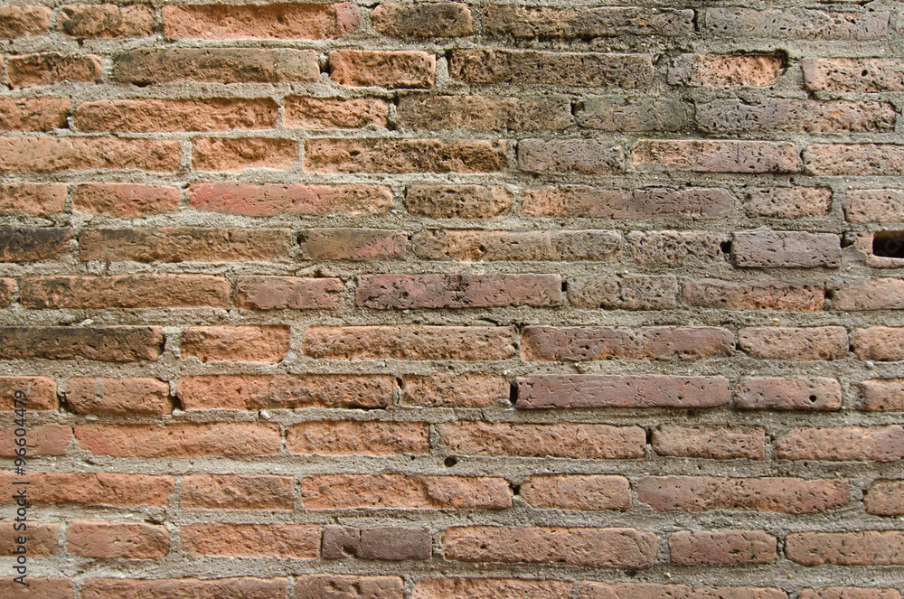 Brown brick wall in an old contemporary temple in Thailand Brown brick wall in an old contemporary temple in Thailand
