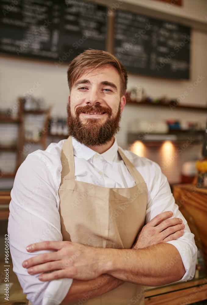 Fotografie Happy young barista at work