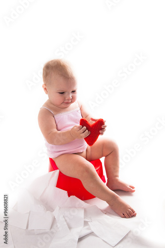 baby on the pot, white background photo