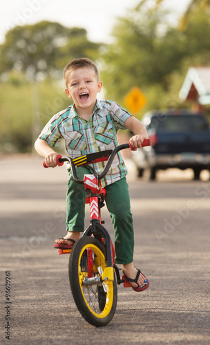 Fototapeta Naklejka Na Ścianę i Meble -  Laughing Child on Bike