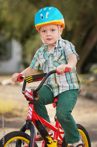 Child in Bike Helmet Riding