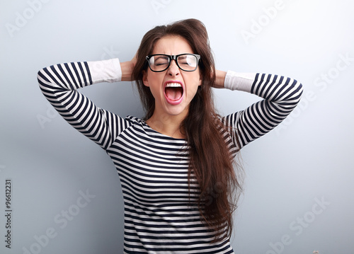 Photographie Anger young business woman in glasses strong screaming with wild