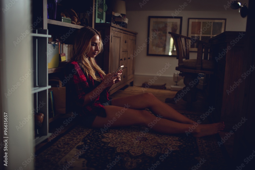 Pretty woman using smartphone in the dark Pretty woman using smartphone in the dark