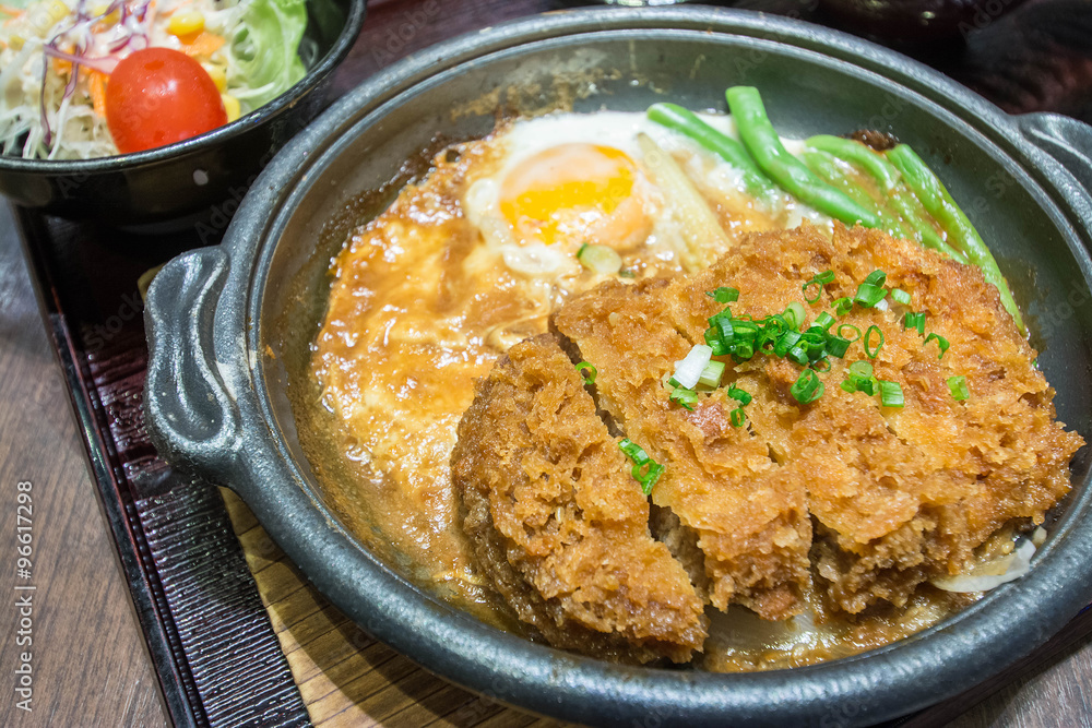 Deep Fired pork boiled  with fresh egg top on the rice bowl. basic Japanese food