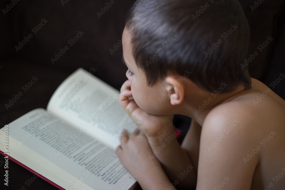 Elementary boy reading. Elementary boy reading.