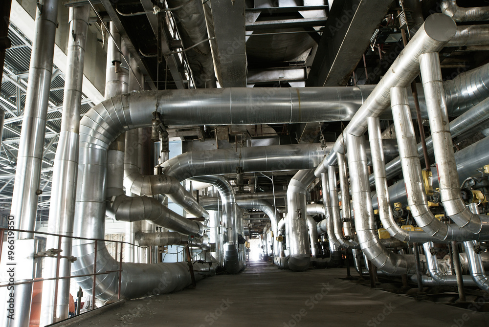 different size and shaped pipes and valves at a power plant
