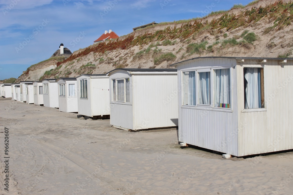 In Denmark, Scandinavia, Europe. Bath houses on the beach of Lokken, Northern Jutland.