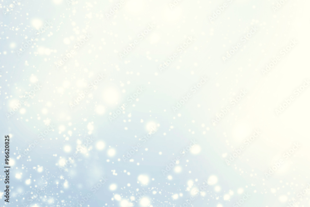 Fototapeta premium Abstract glittering stars on bokeh background. Festive blue an