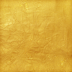 Shiny yellow leaf gold foil texture background