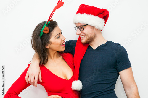 Young couple hugging and smiling. Christmas time