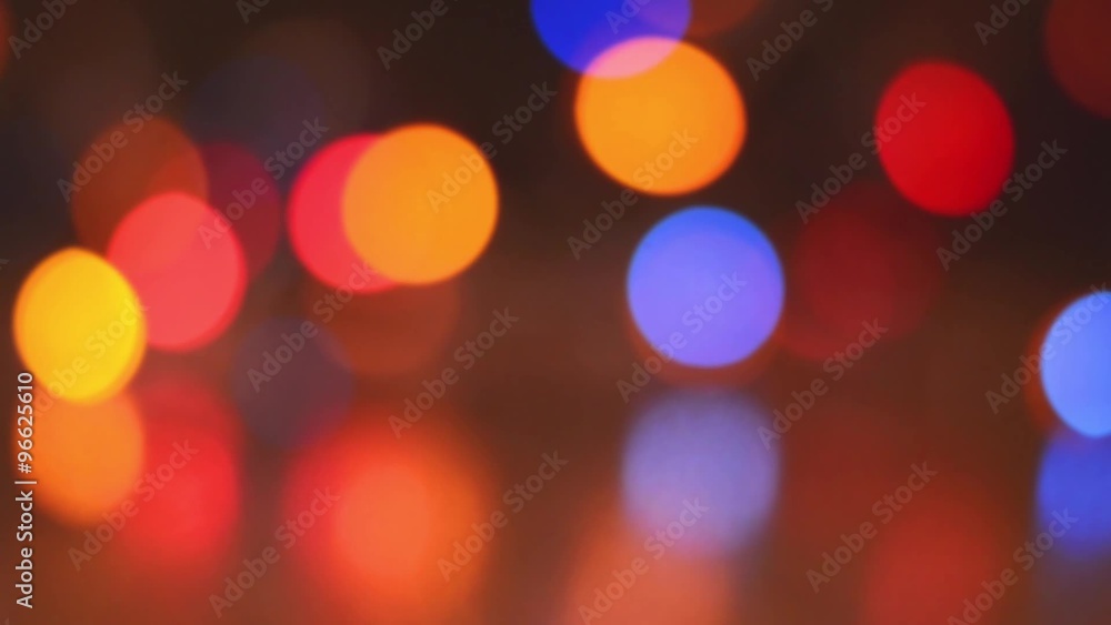 Blurring background flashing multi-colored Christmas garland Blurring background flashing multi-colored Christmas garland