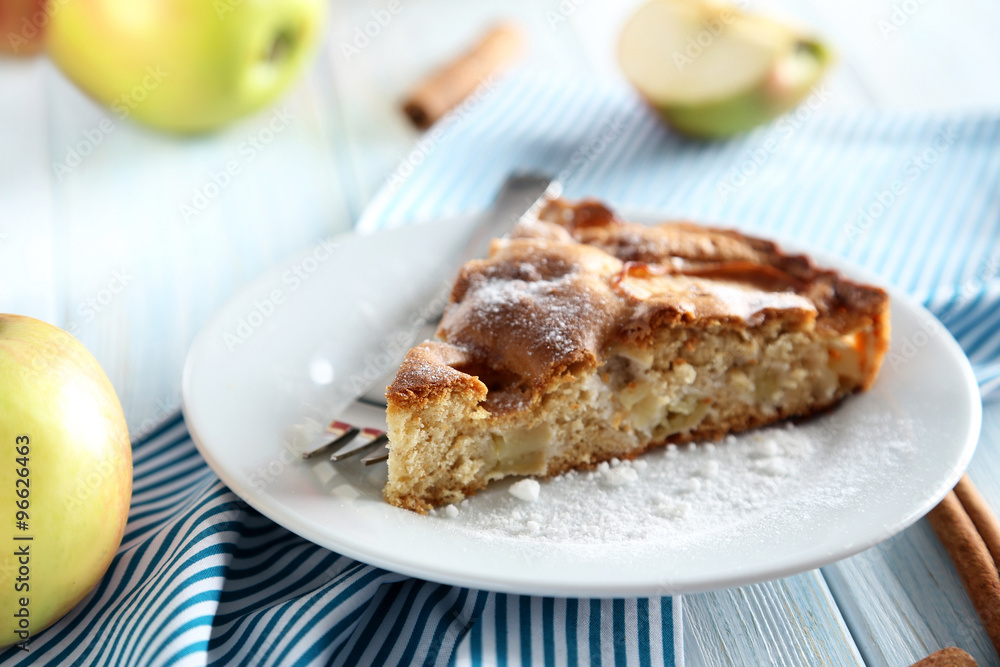 Homemade apple cake on blue wooden table Homemade apple cake on blue wooden table