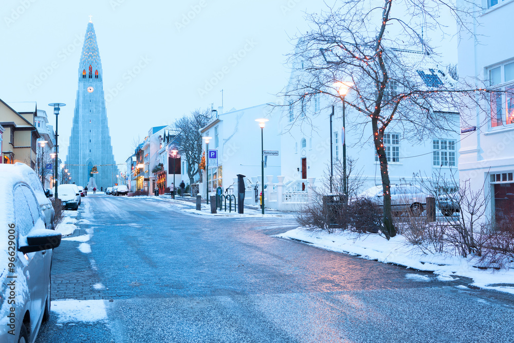 Old street of  downtown Reykjavik, Iceland.          in the background church of Hallgrimur